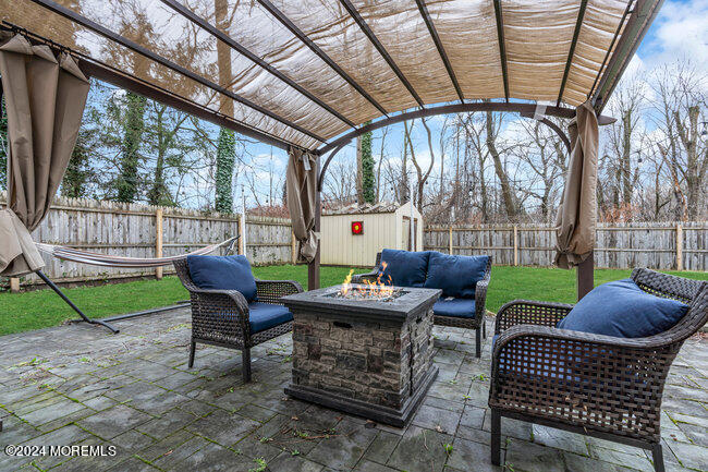 479 Morris Way Belford, NJ 07718 - Photo 7 of 23 Rear Exterior with Patio & Pergola