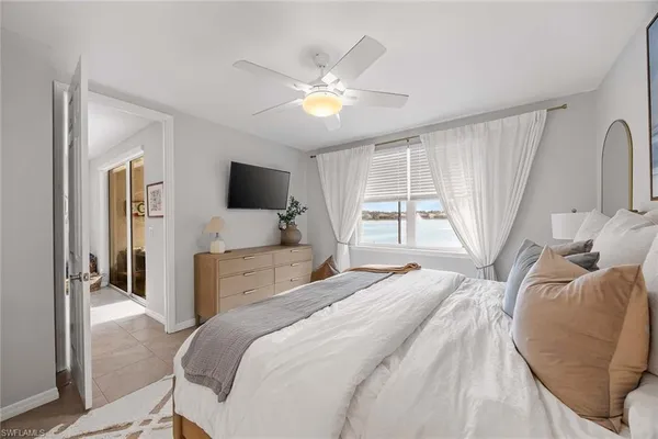 a bathroom with a double vanity sink mirror and toilet