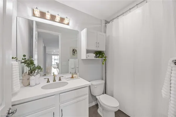 a bathroom with a sink and a stove top oven