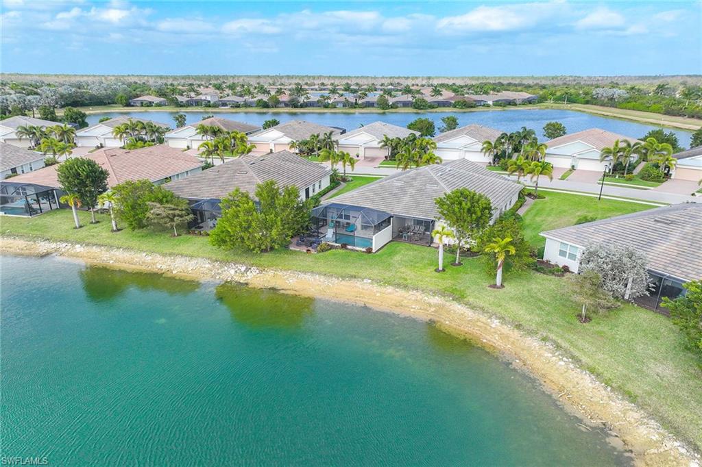 14610 Edgewater Circle Naples, FL 34114 - Photo 30 of 38 an aerial view of a city with lawn chairs