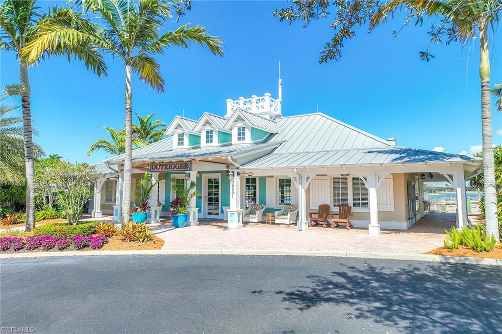 14610 Edgewater Circle Naples, FL 34114 - Photo 32 of 38 a view of a building with a park