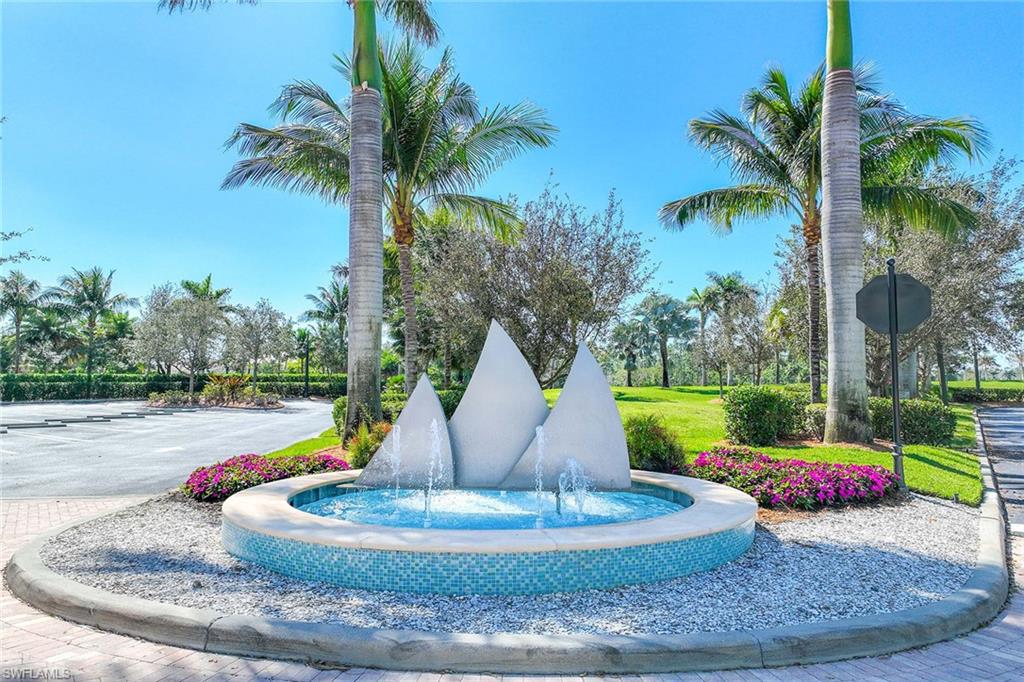 14610 Edgewater Circle Naples, FL 34114 - Photo 38 of 38 a view of a house with a yard and palm trees