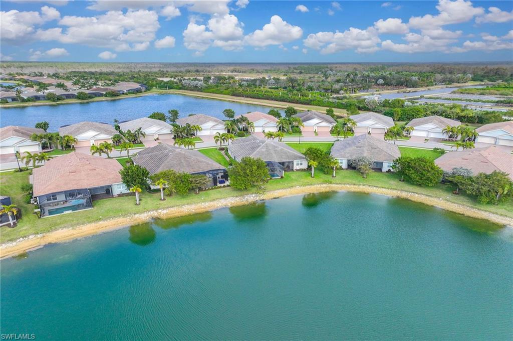 14610 Edgewater Circle Naples, FL 34114 - Photo 5 of 38 an aerial view of residential houses with outdoor space swimming pool and mountain view