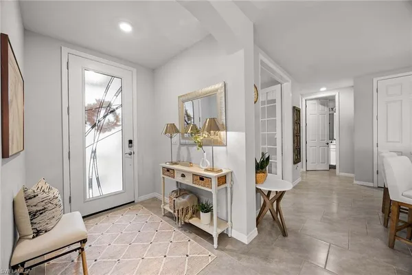 a living room with furniture and a table
