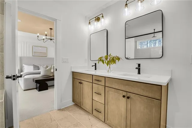 a bathroom with a sink and a mirror