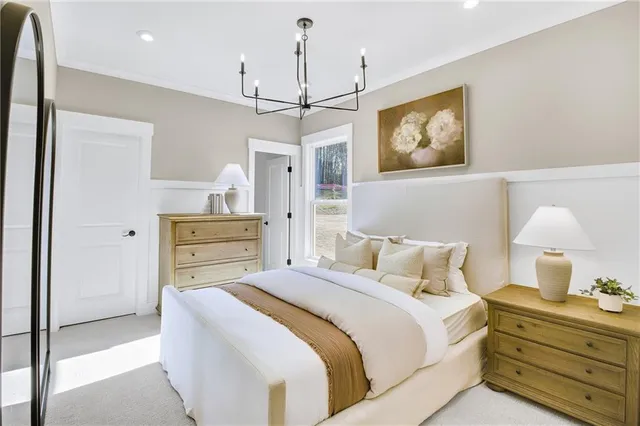 a bedroom with a bed and ceiling fan