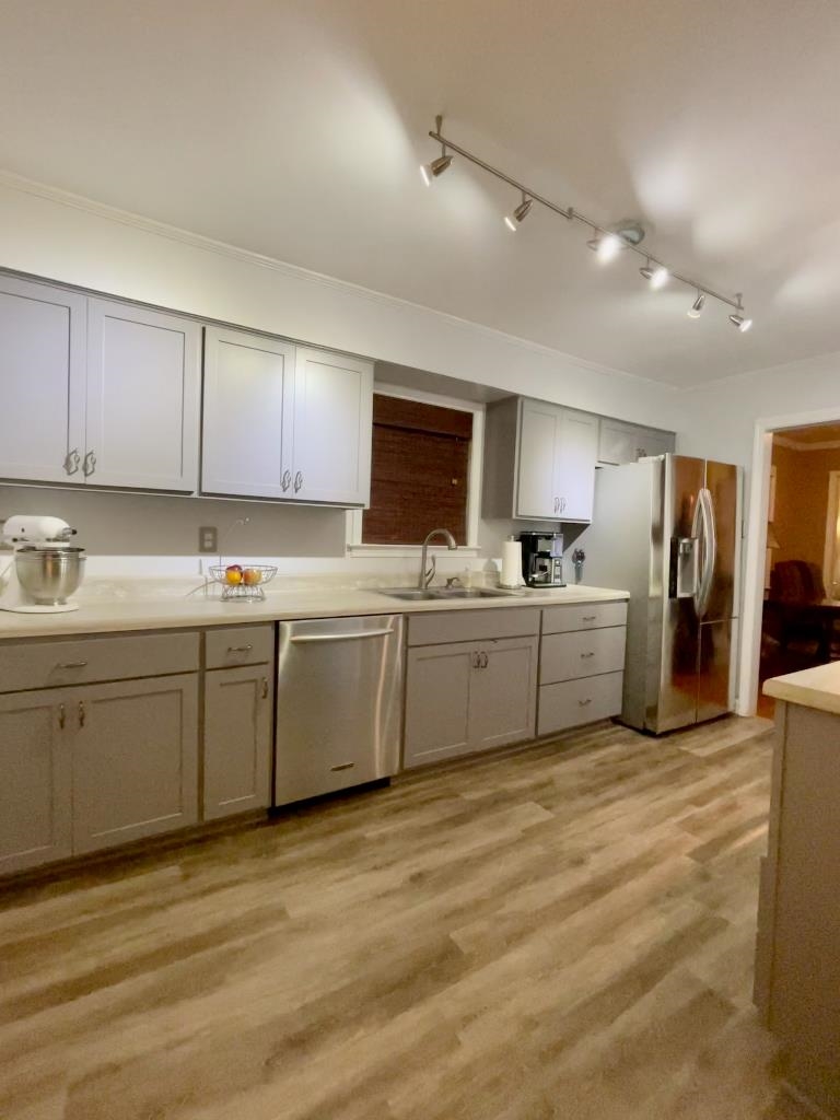 11425 Macon Road Eads, TN 38028 - Photo 6 of 11 a kitchen with stainless steel appliances granite countertop a sink refrigerator and cabinets