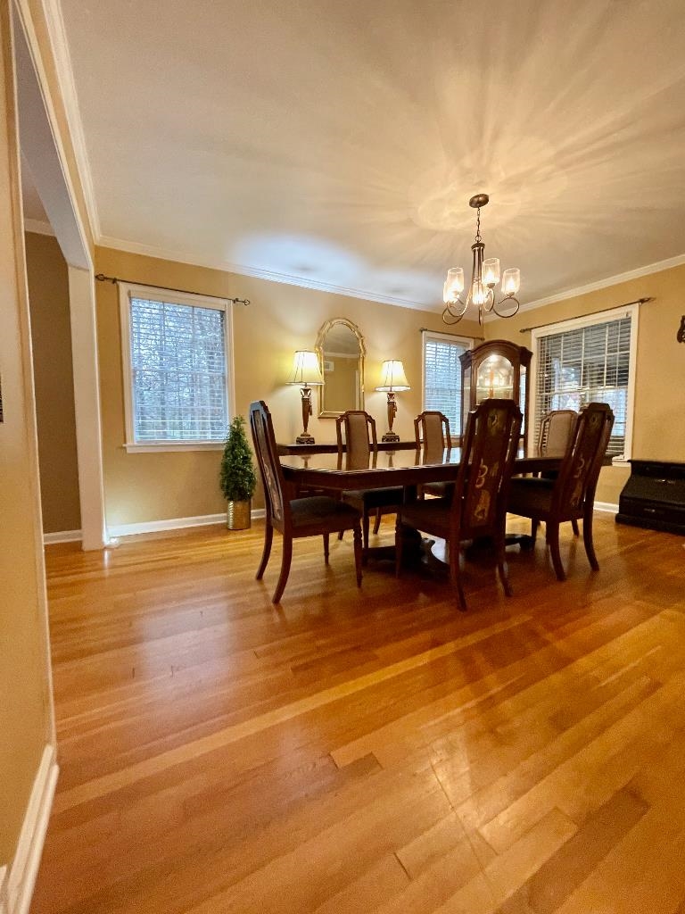 11425 Macon Road Eads, TN 38028 - Photo 8 of 11 a view of a dining room with furniture and chandelier