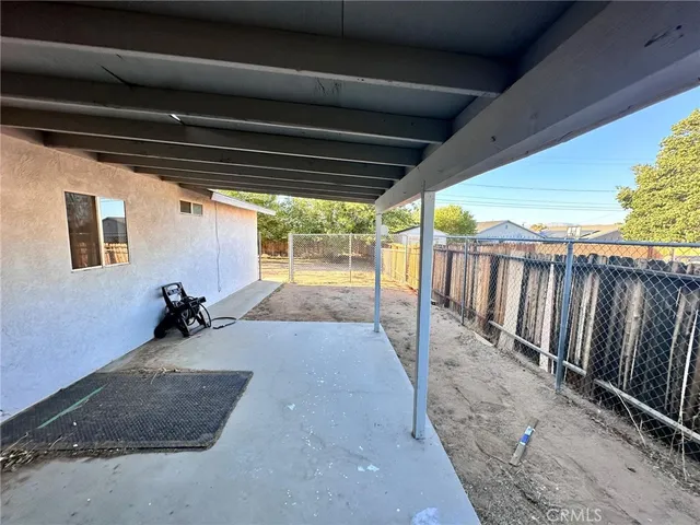 a view of outdoor space with wooden fence