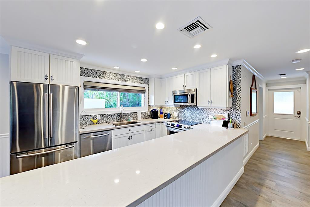 1758 Southeast 7th Street Fort Lauderdale, FL 33316 - Photo 15 of 19 a kitchen with refrigerator and cabinets