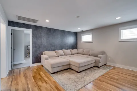 a spacious bedroom with a bed and a couch