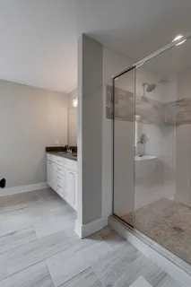 a view of kitchen with white cabinets and white appliances
