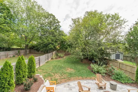 a backyard of a house with lots of green space