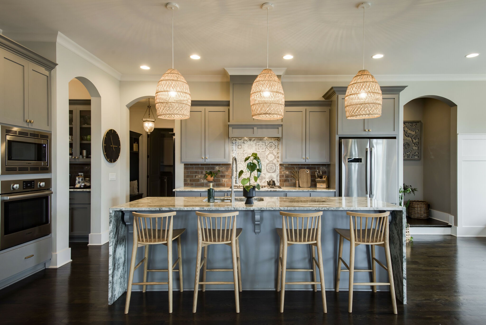 121 Princess Circle Franklin, TN 37064 - Photo 13 of 38 a kitchen with stainless steel appliances kitchen island granite countertop a kitchen island and chairs in it