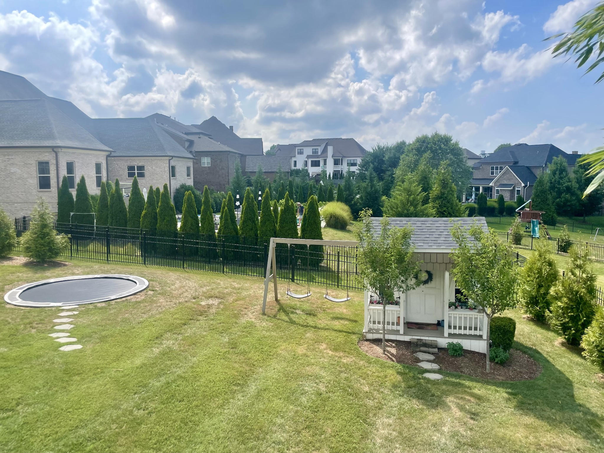 121 Princess Circle Franklin, TN 37064 - Photo 33 of 38 a swimming pool with outdoor seating and garden