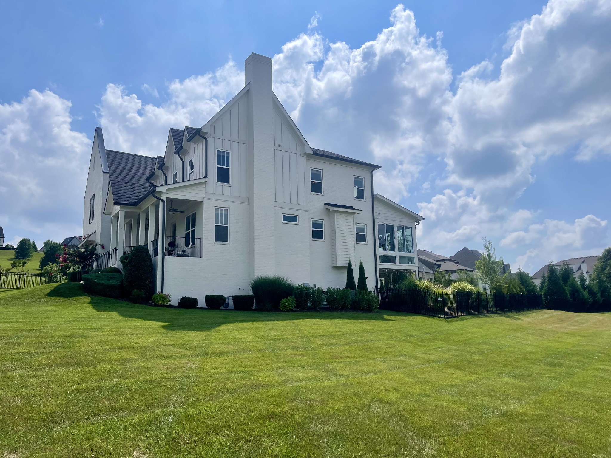 121 Princess Circle Franklin, TN 37064 - Photo 4 of 38 a view of a big house with a big yard and a large tree