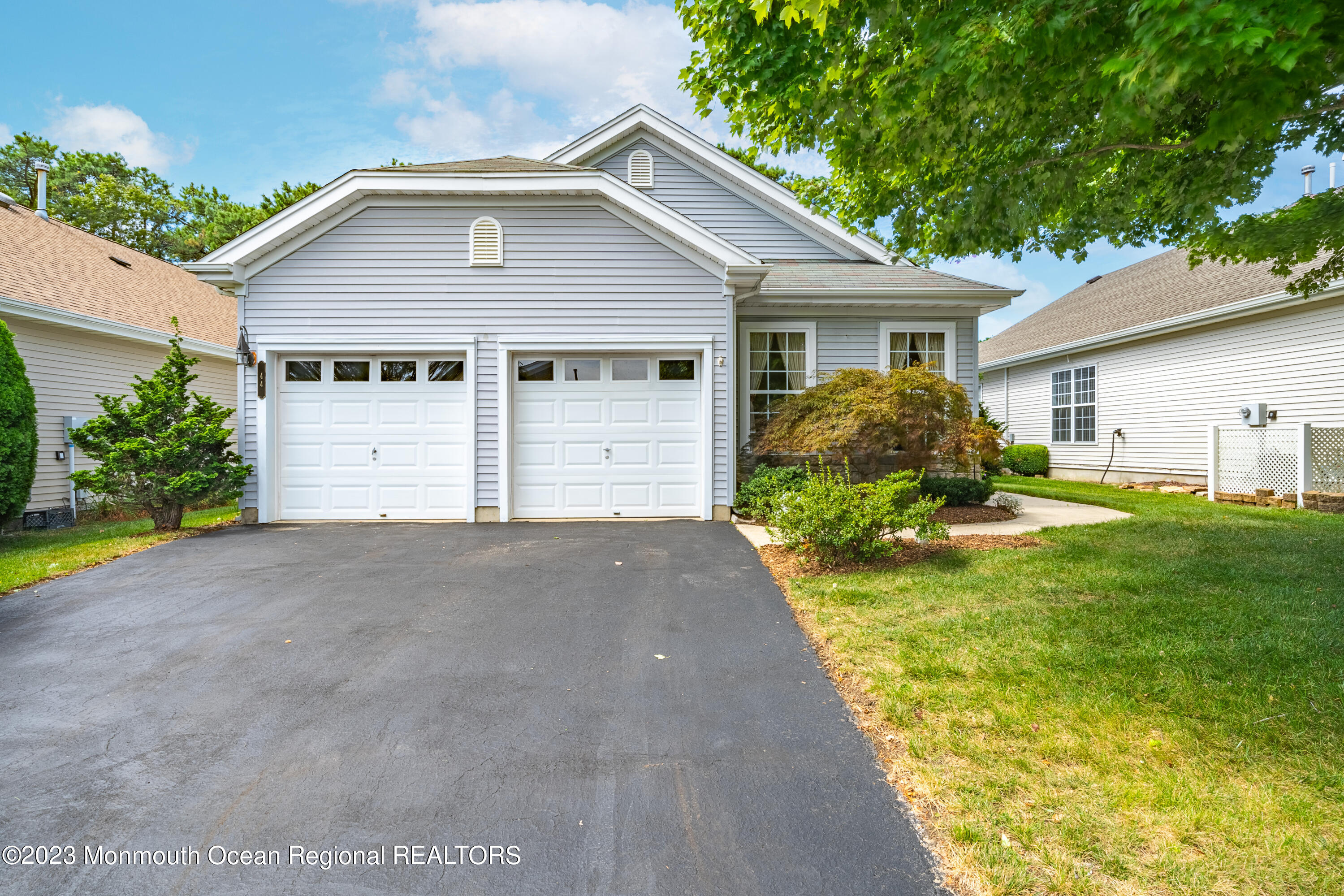 44 Sandpiper Road Barnegat, NJ 08005 - Photo 1 of 27 a view of a house with a yard and garage