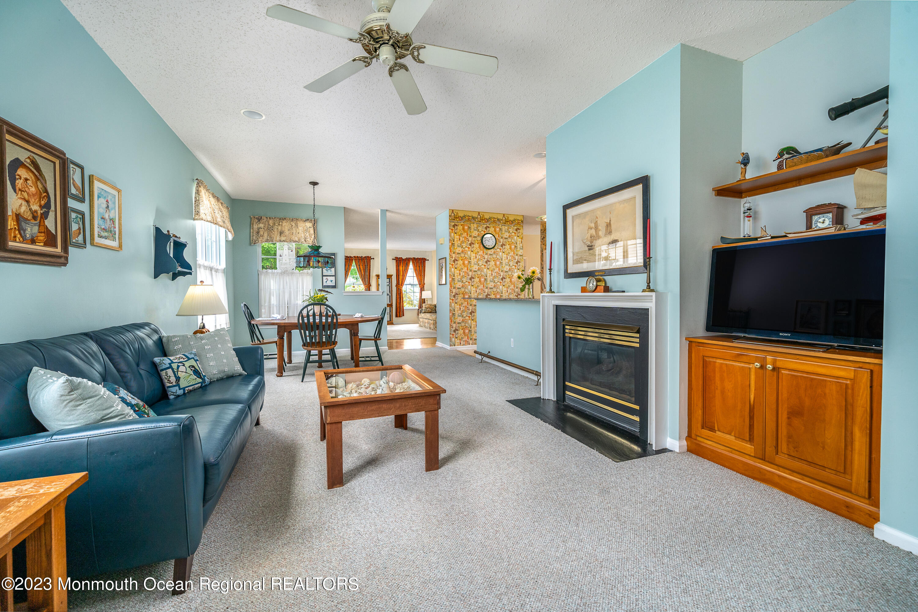 44 Sandpiper Road Barnegat, NJ 08005 - Photo 12 of 27 a living room with furniture and a flat screen tv