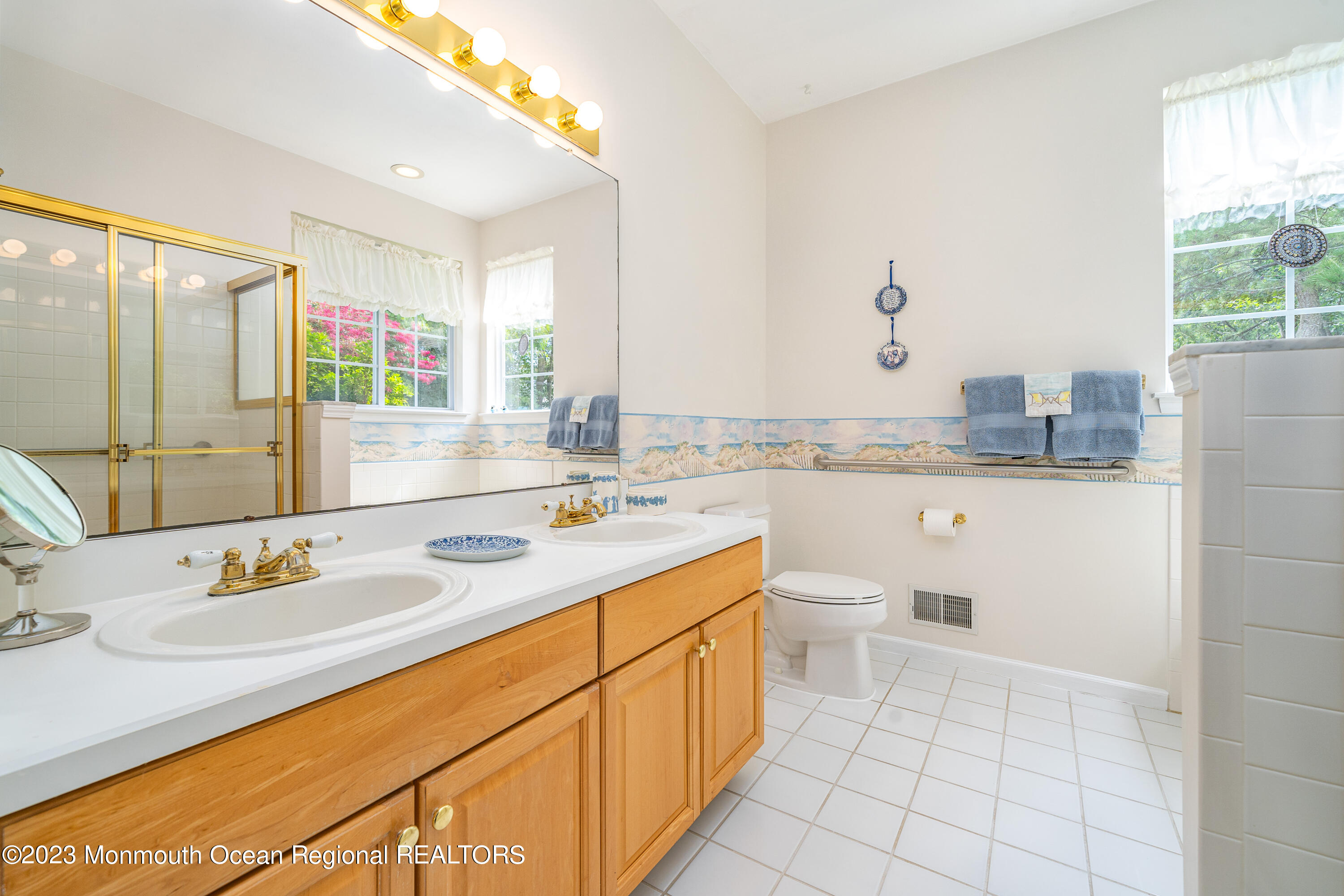 44 Sandpiper Road Barnegat, NJ 08005 - Photo 16 of 27 a bathroom with a granite countertop sink mirror and a