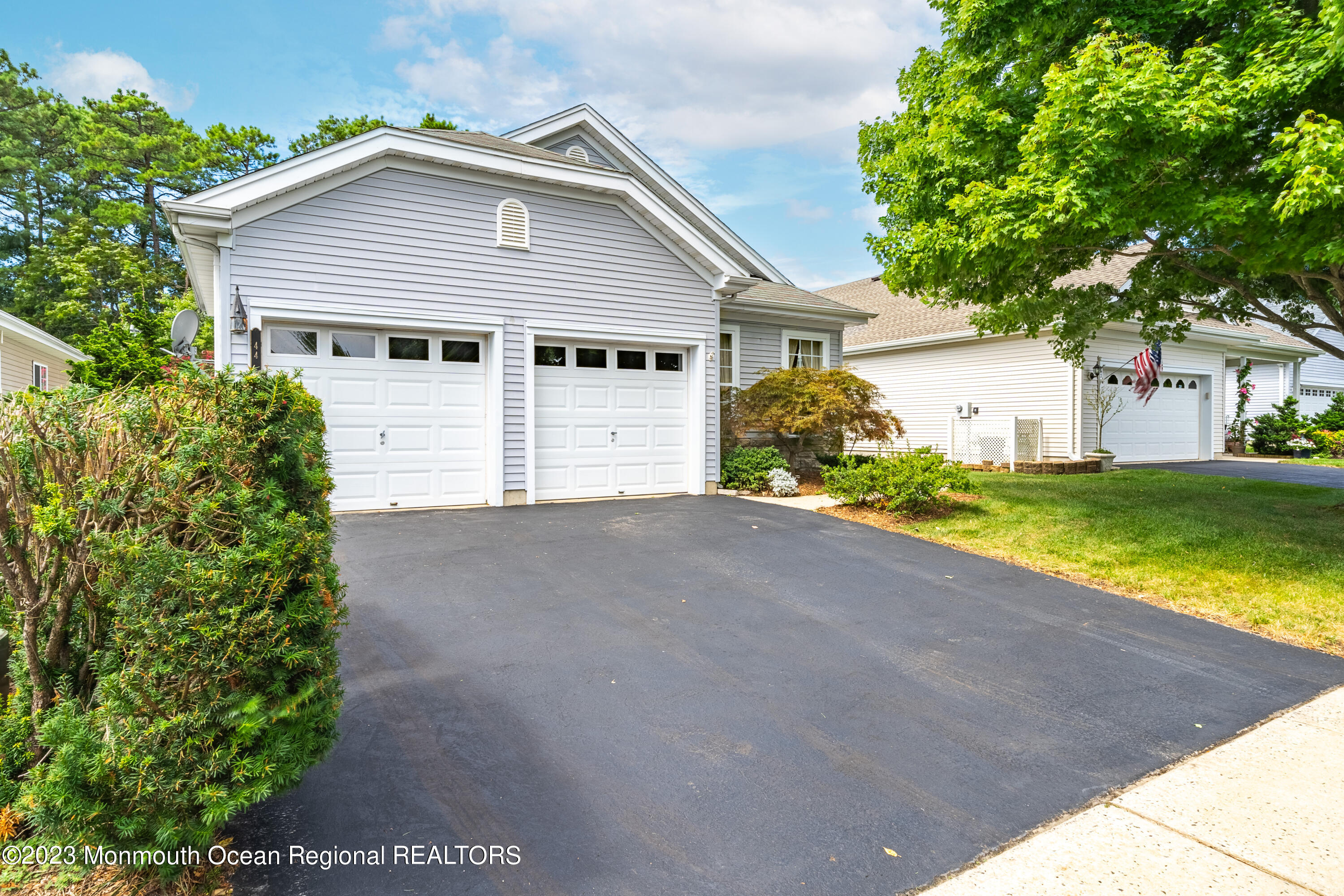 44 Sandpiper Road Barnegat, NJ 08005 - Photo 3 of 27 a view of a house with a yard and garage