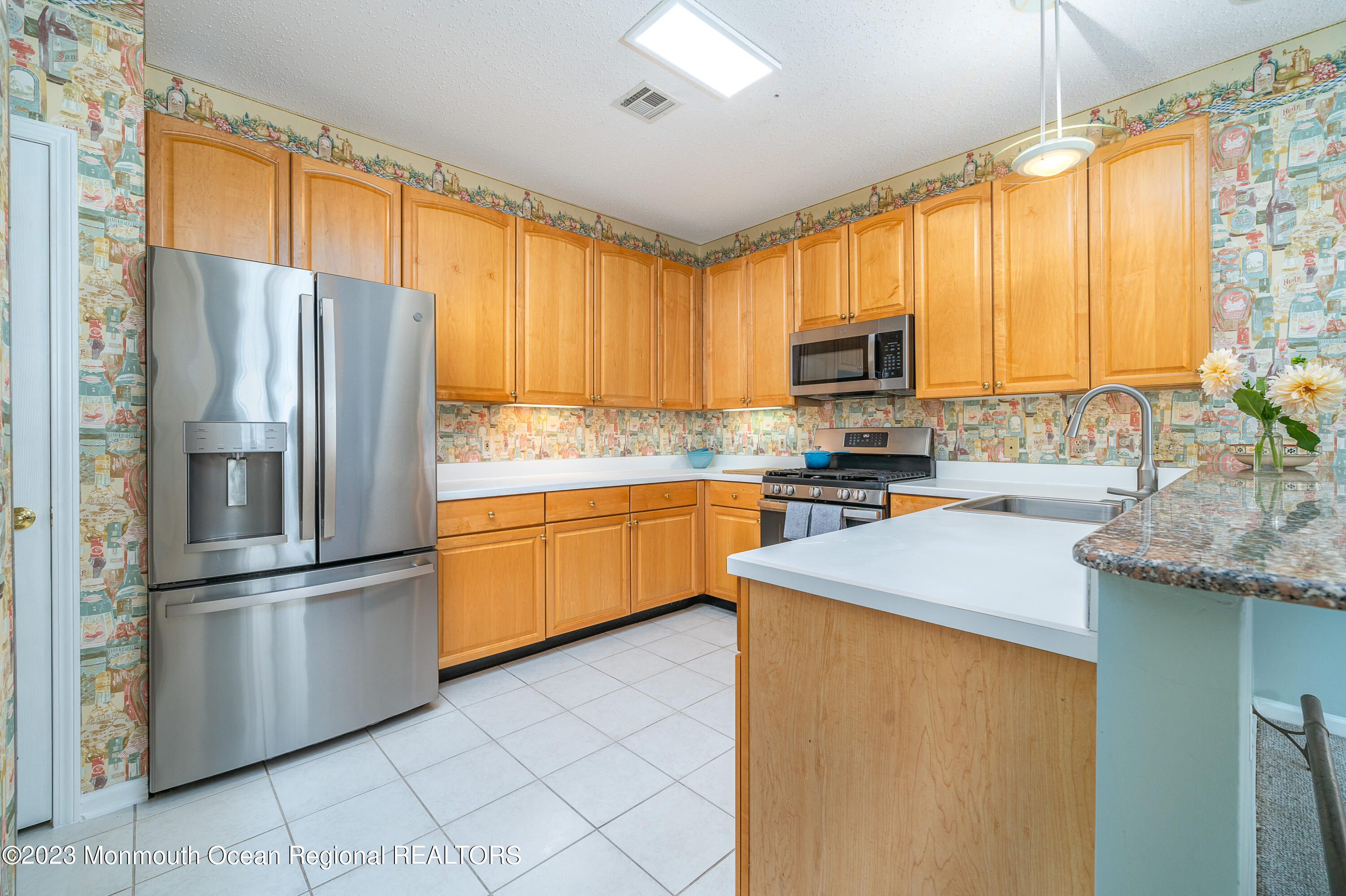 44 Sandpiper Road Barnegat, NJ 08005 - Photo 8 of 27 a kitchen with stainless steel appliances granite countertop a refrigerator a sink and a stove
