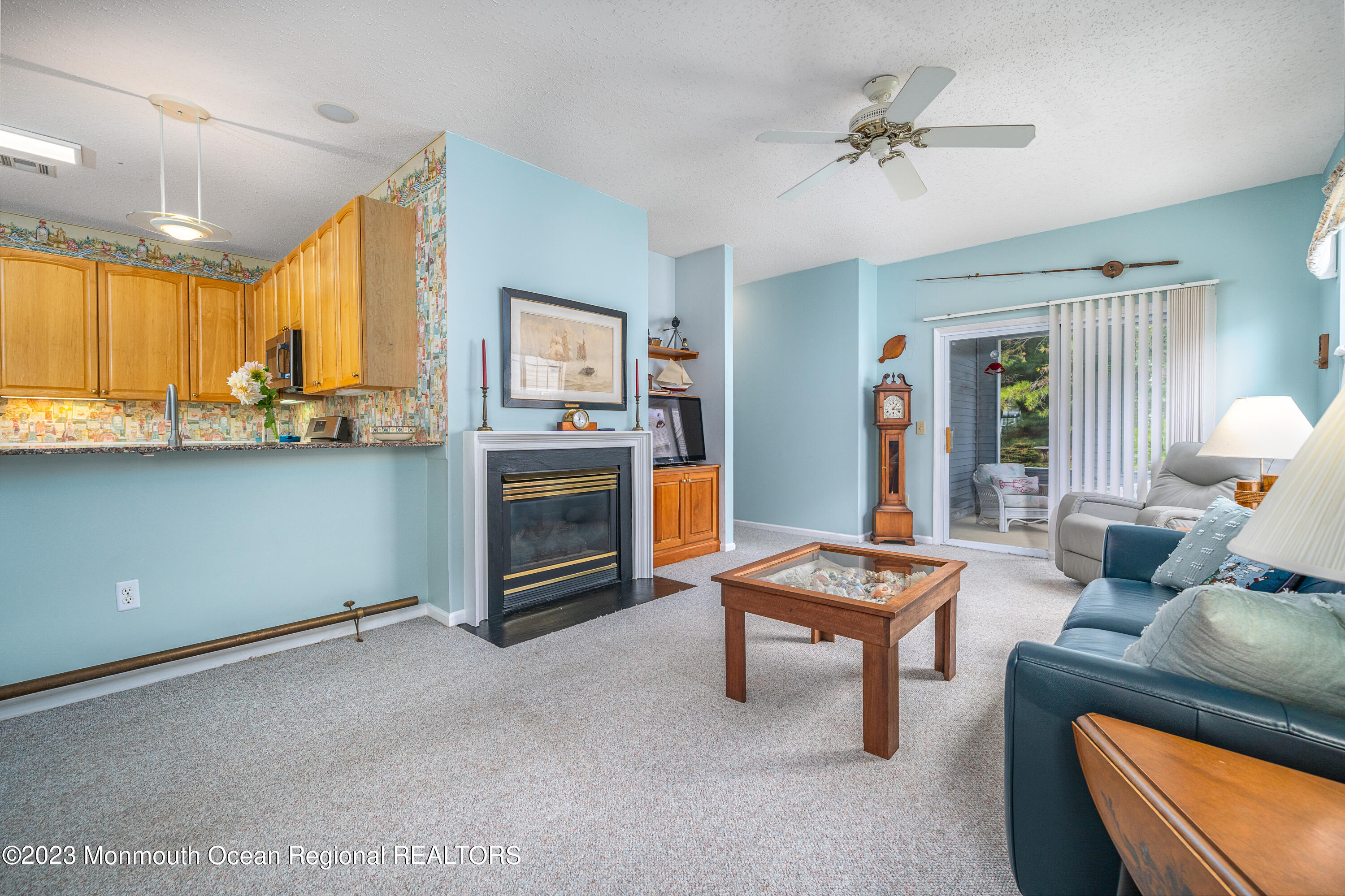 44 Sandpiper Road Barnegat, NJ 08005 - Photo 10 of 27 a living room with furniture and a fireplace