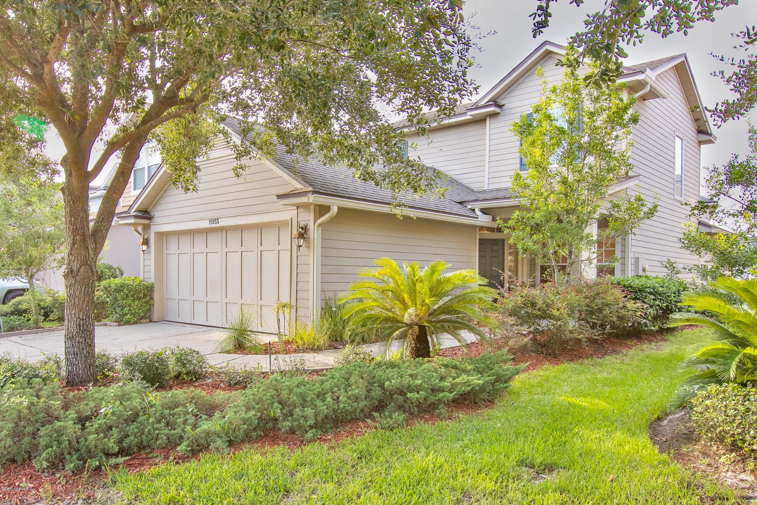 11855 Templeton Road Jacksonville, FL 32258 - Photo 1 of 23 a front view of a house with garden