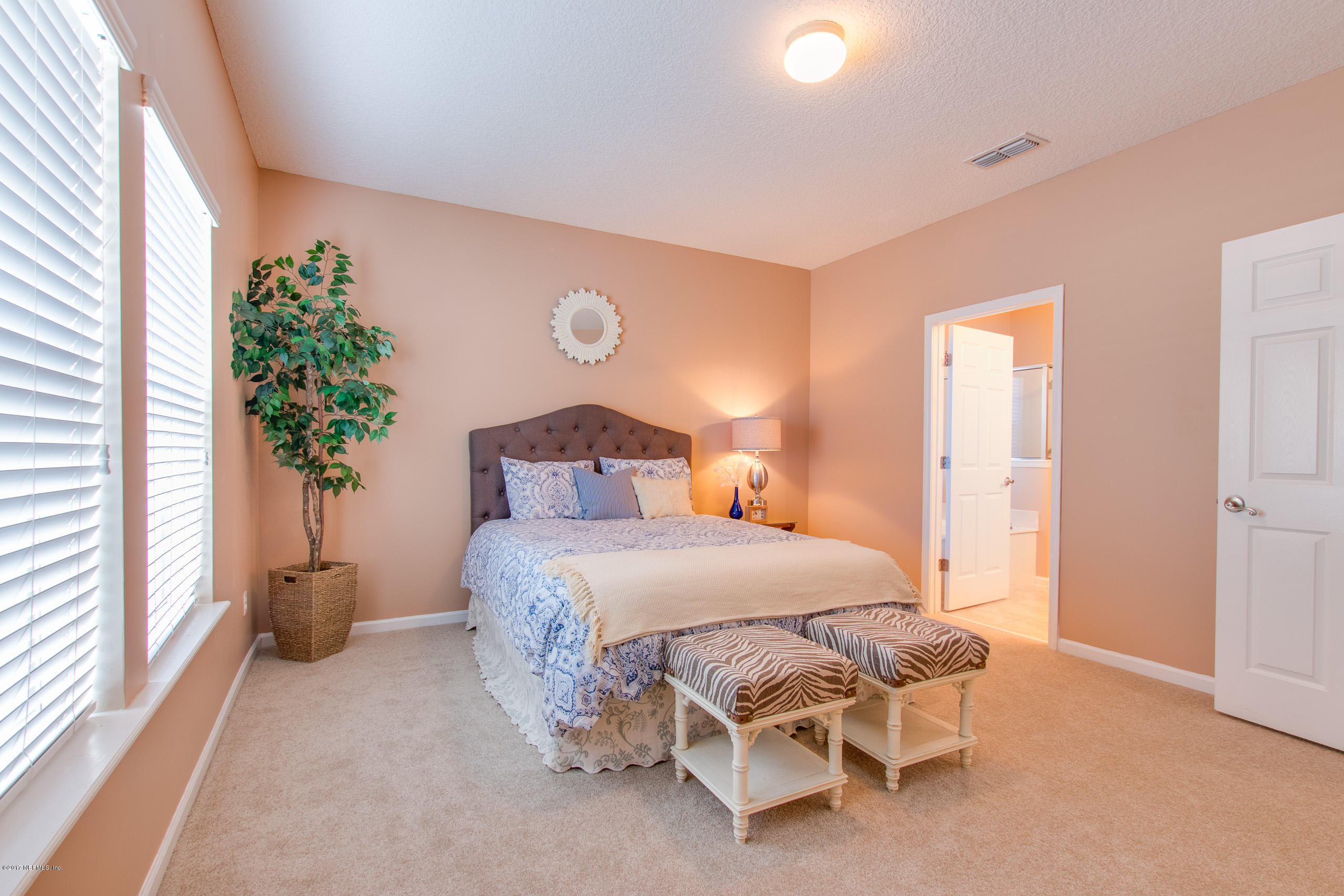 11855 Templeton Road Jacksonville, FL 32258 - Photo 13 of 23 a bedroom with a bed and a potted plant