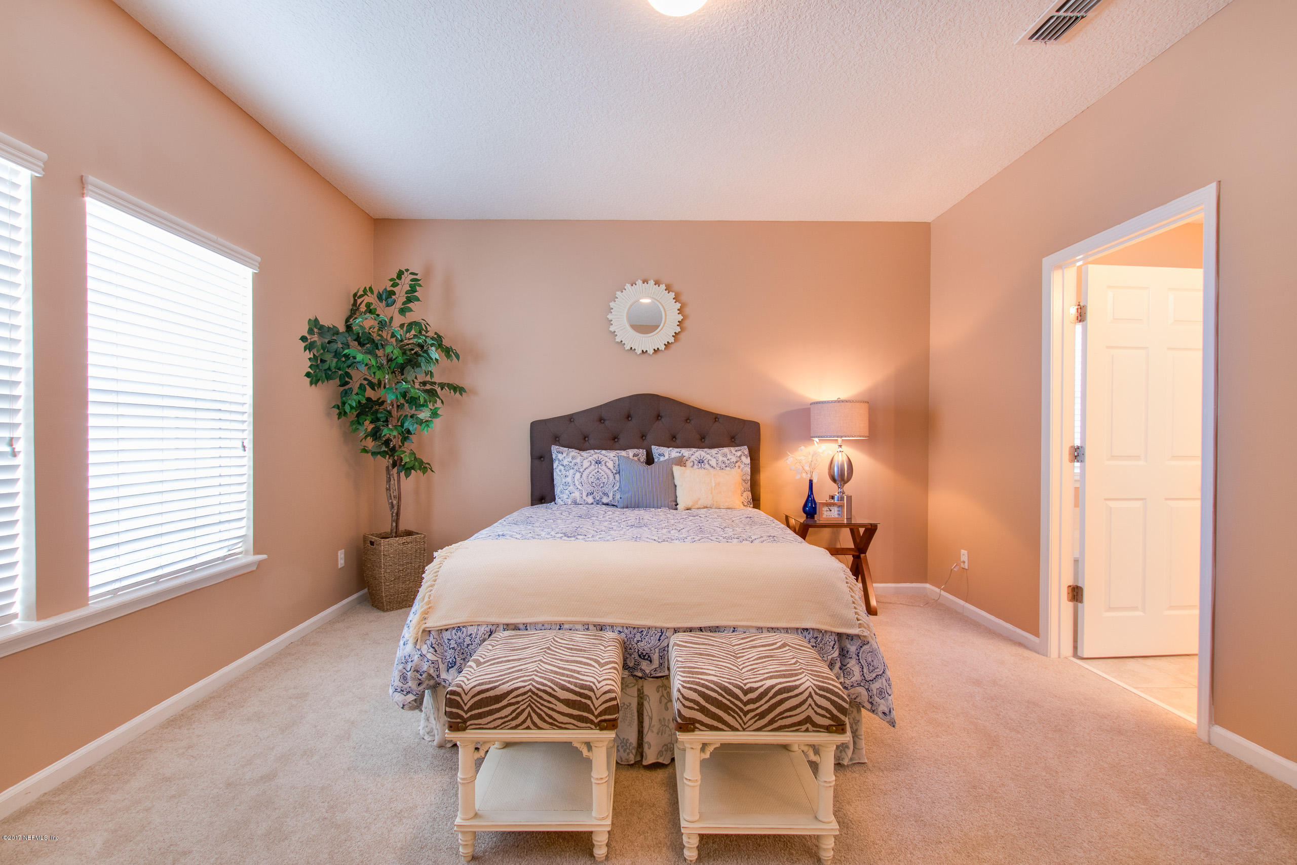 11855 Templeton Road Jacksonville, FL 32258 - Photo 14 of 23 a bedroom with a bed and a potted plant