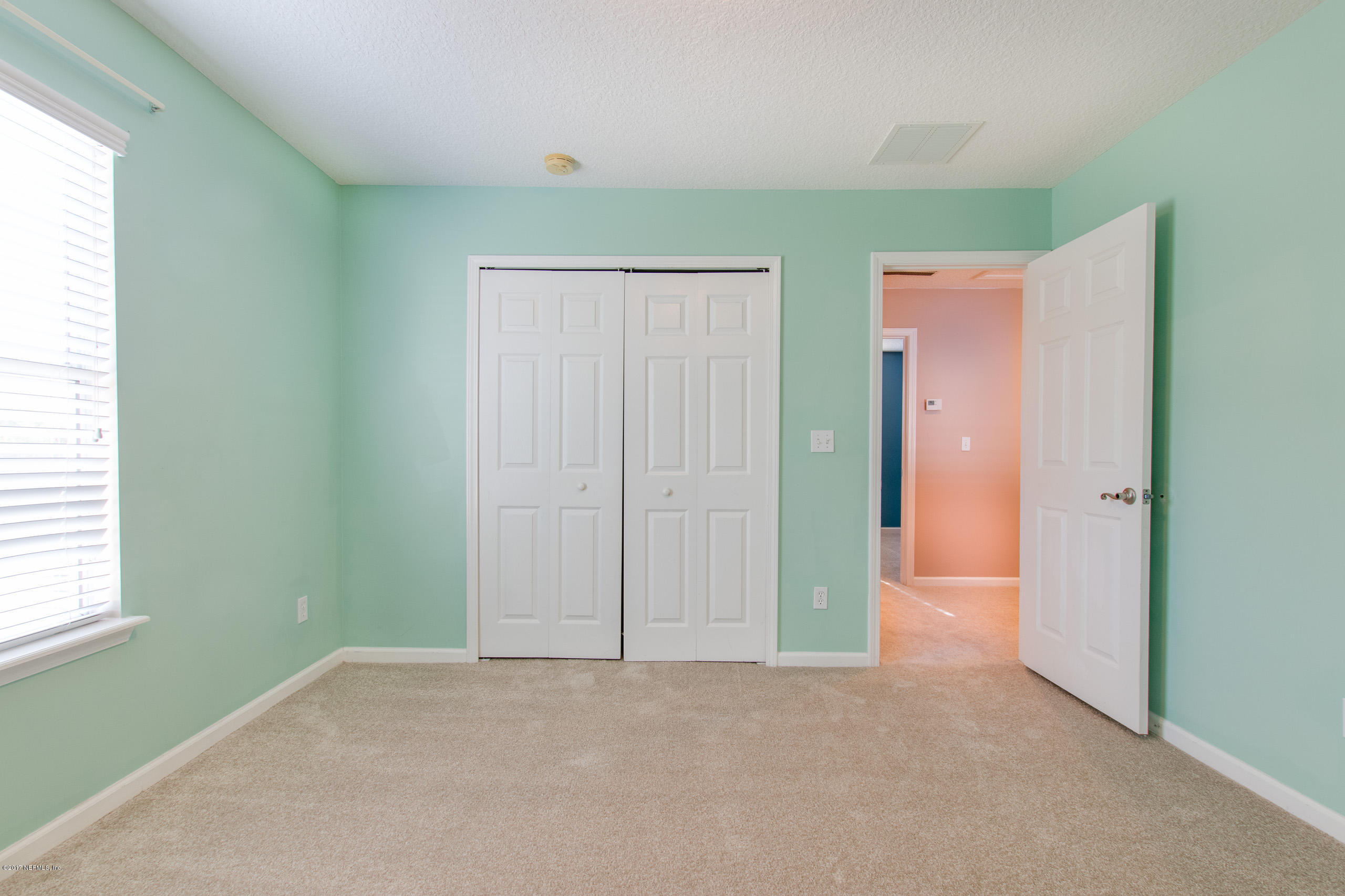 11855 Templeton Road Jacksonville, FL 32258 - Photo 15 of 23 an empty room with windows and closet
