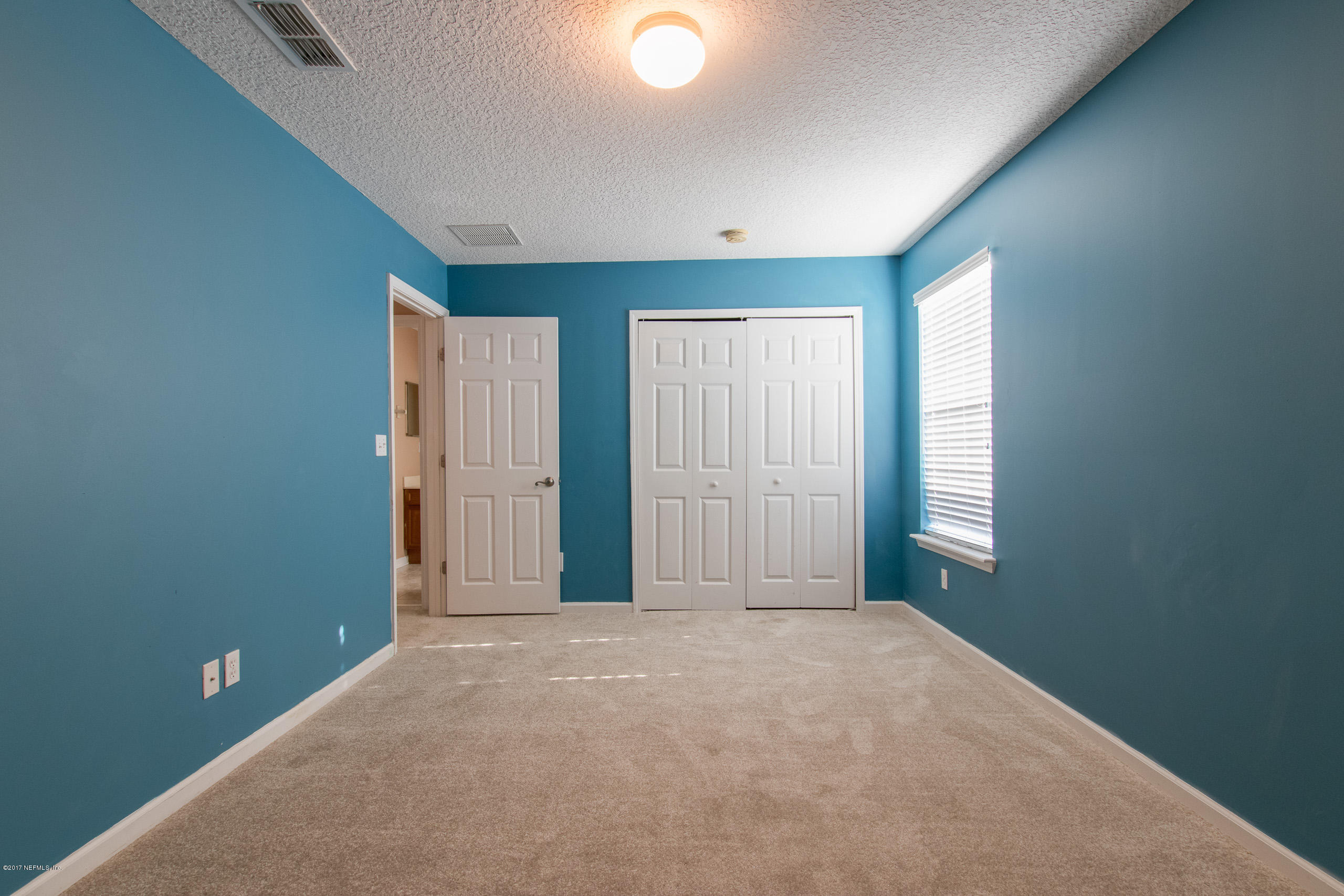 11855 Templeton Road Jacksonville, FL 32258 - Photo 18 of 23 a view of an empty room with a window