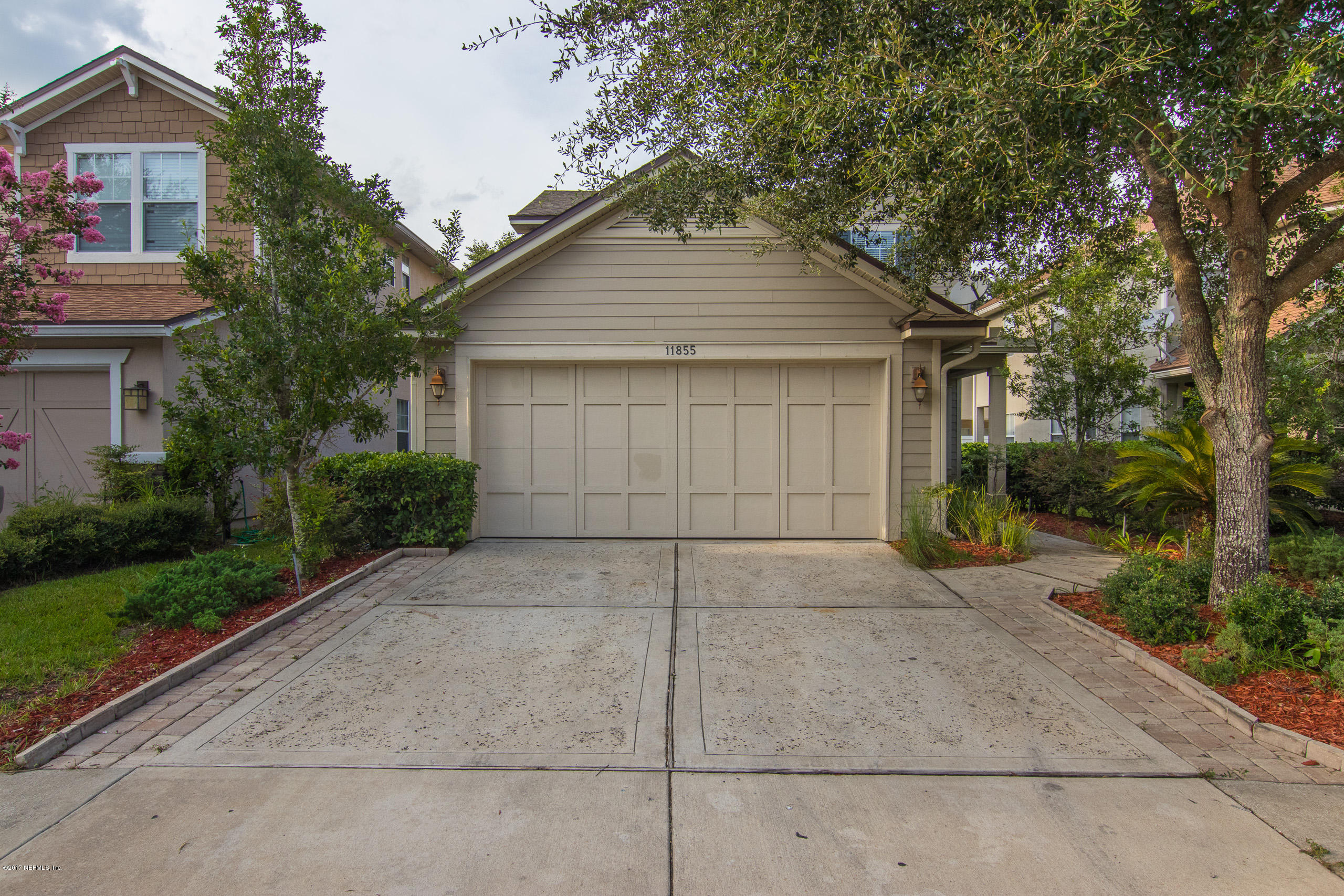 11855 Templeton Road Jacksonville, FL 32258 - Photo 2 of 23 a view of garage yard and tree