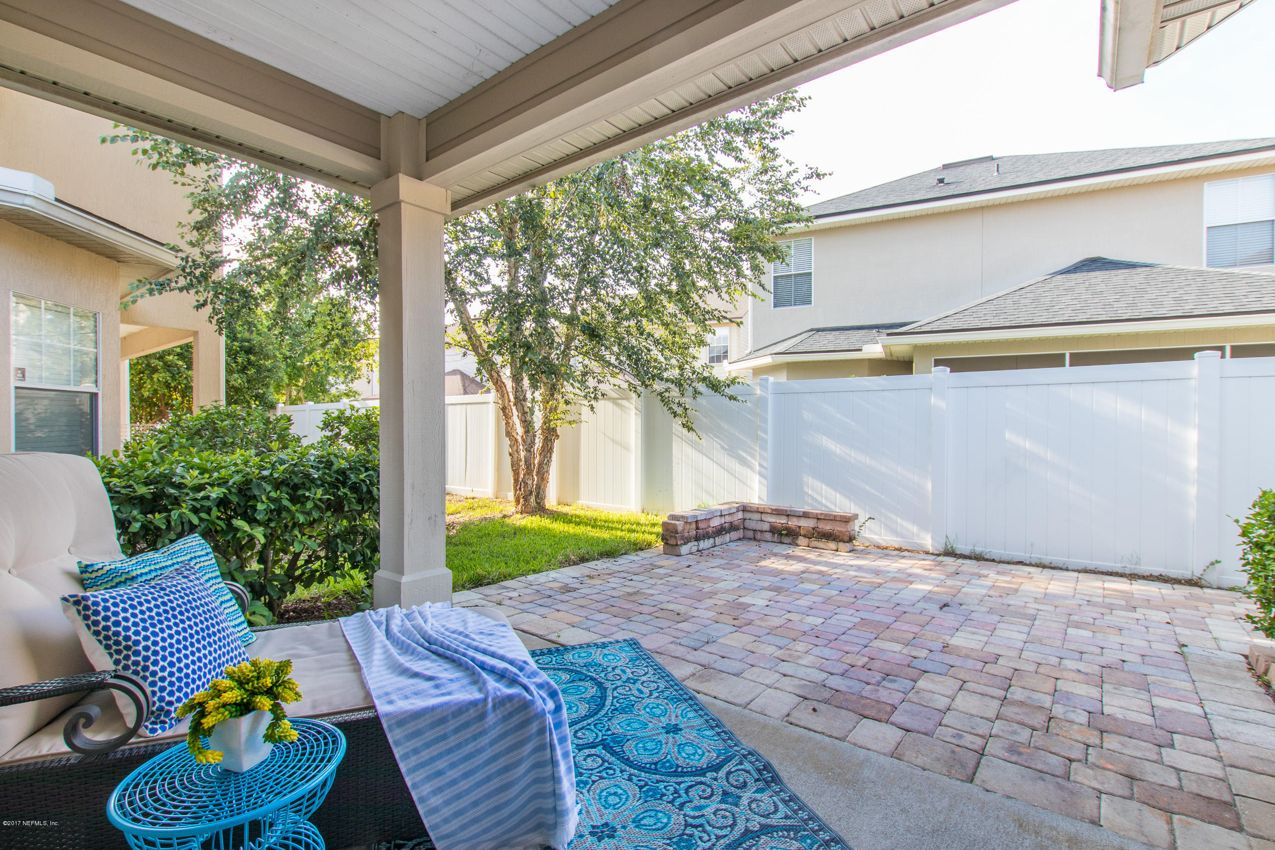 11855 Templeton Road Jacksonville, FL 32258 - Photo 21 of 23 a backyard of a house with table and chairs and potted plants