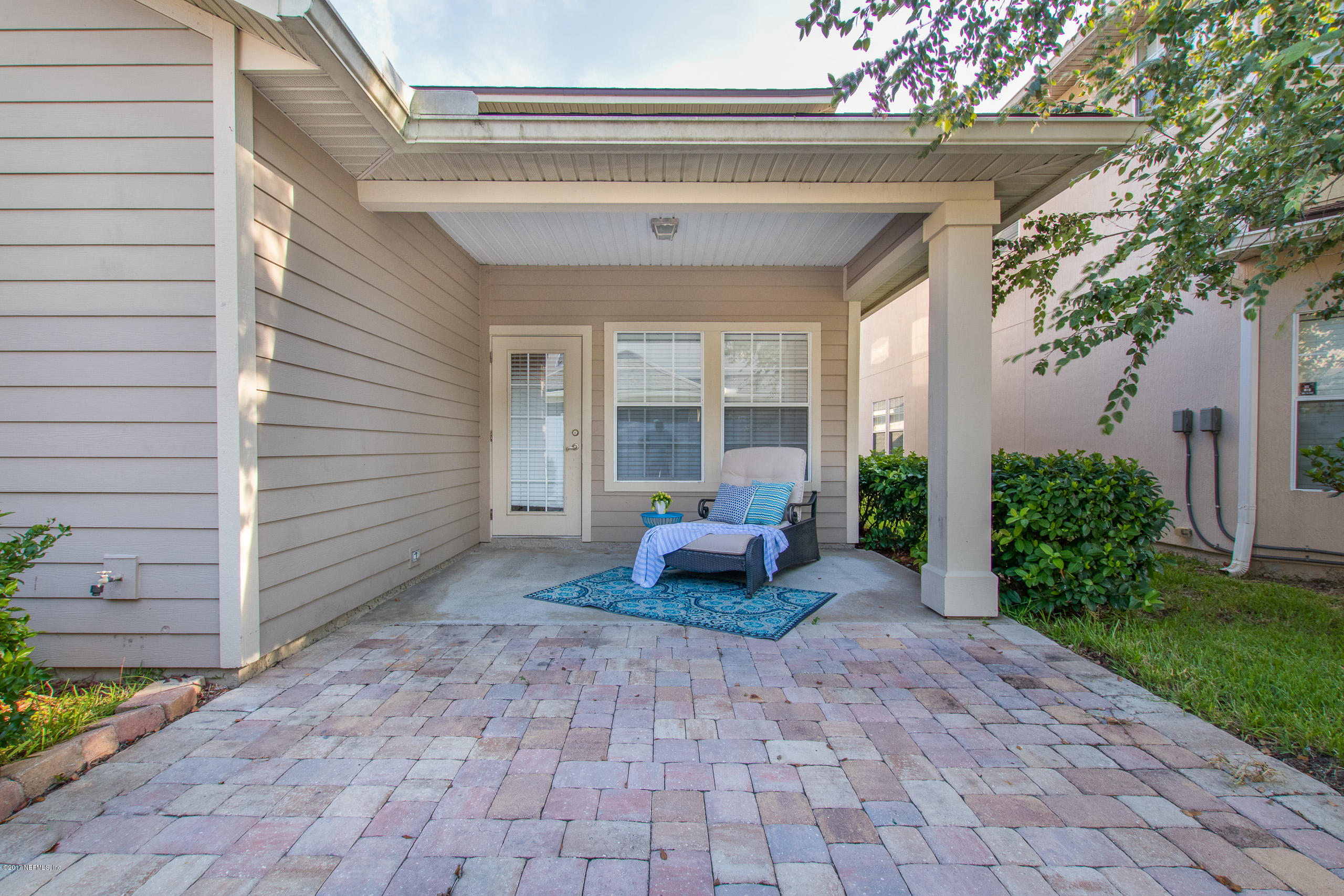 11855 Templeton Road Jacksonville, FL 32258 - Photo 22 of 23 a view of a patio with table and chairs and potted plants