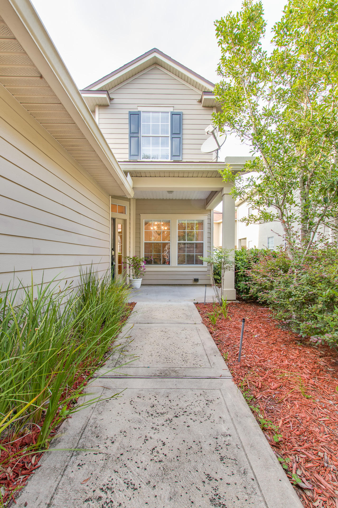 11855 Templeton Road Jacksonville, FL 32258 - Photo 3 of 23 a front view of a house with garden