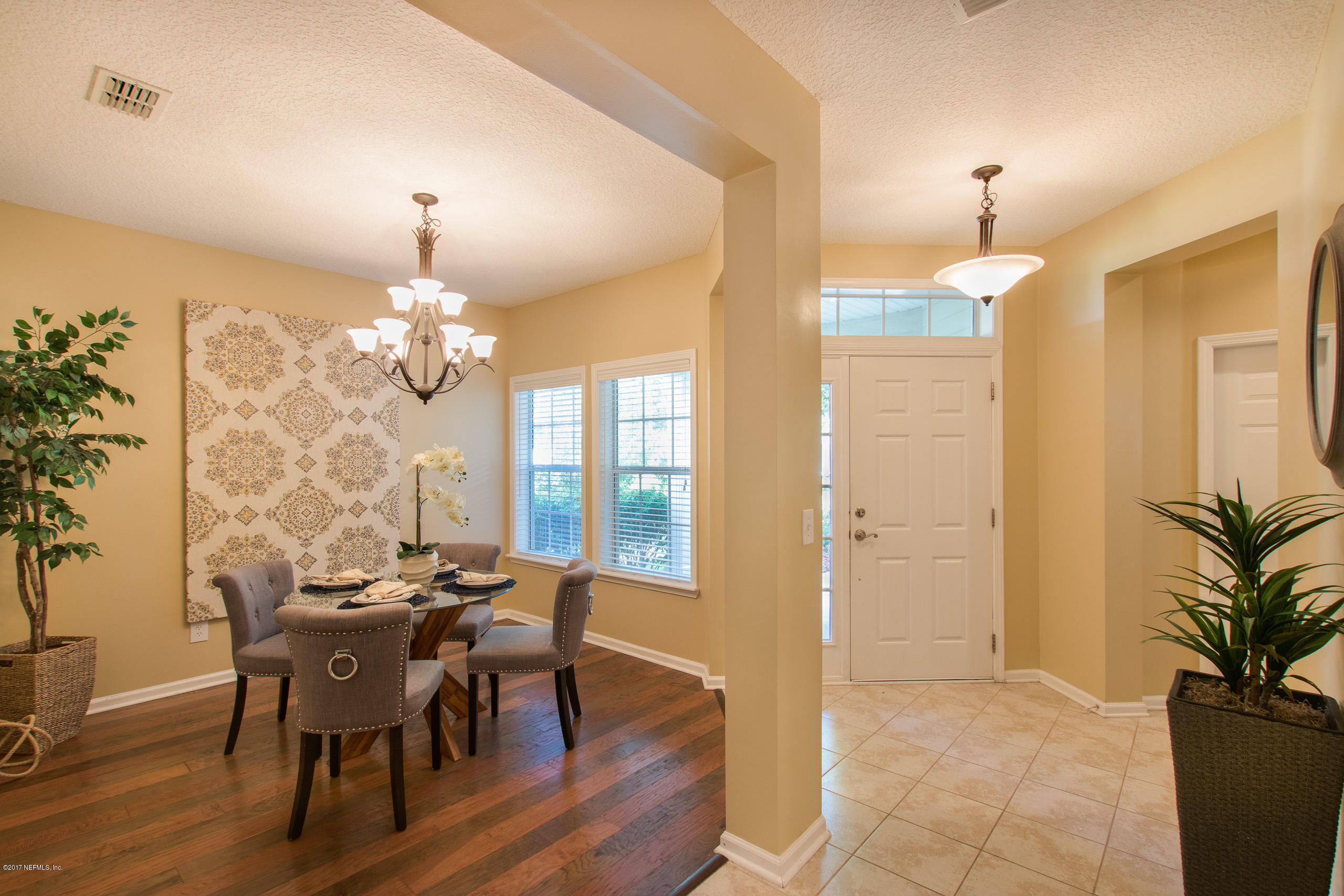 11855 Templeton Road Jacksonville, FL 32258 - Photo 7 of 23 a view of a dining room with furniture and chandelier