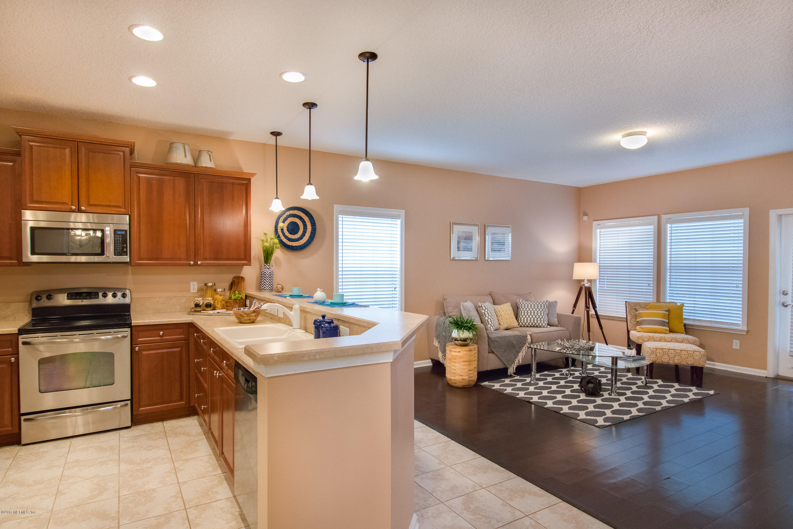 11855 Templeton Road Jacksonville, FL 32258 - Photo 10 of 23 a living room with stainless steel appliances granite countertop furniture sink and wooden floor