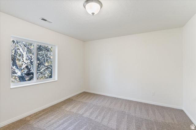 2078 Spring Oaks Drive Springville, UT 84663 - Photo 25 of 40 Empty room with light colored carpet and baseboards
