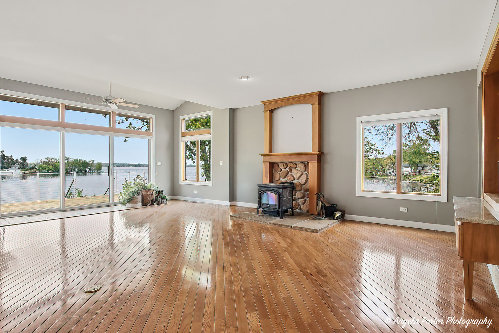 35166 Lake Shore Road Ingleside, IL 60041 - Photo 12 of 39 a view of a livingroom with furniture hardwood floor and a large window