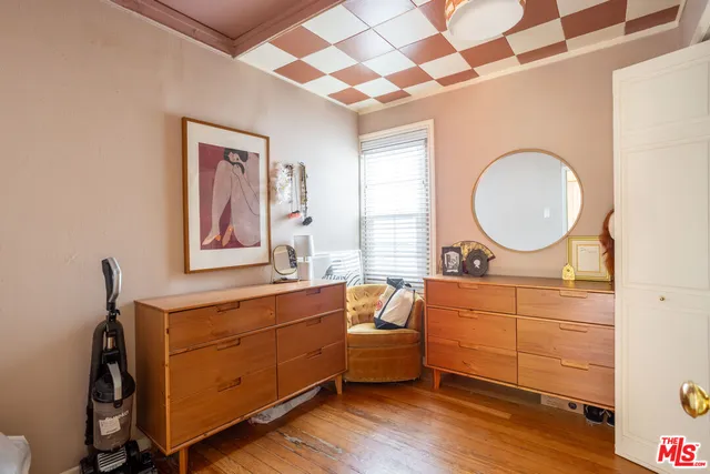 a bedroom with a bed and a stove