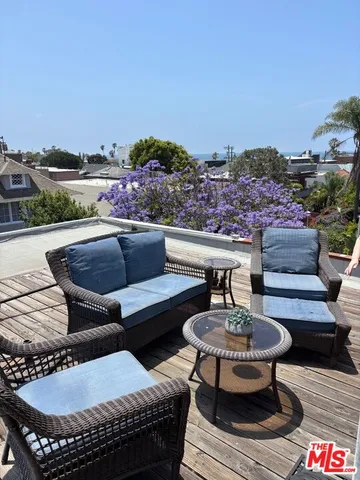 a outdoor space with a couch and chairs