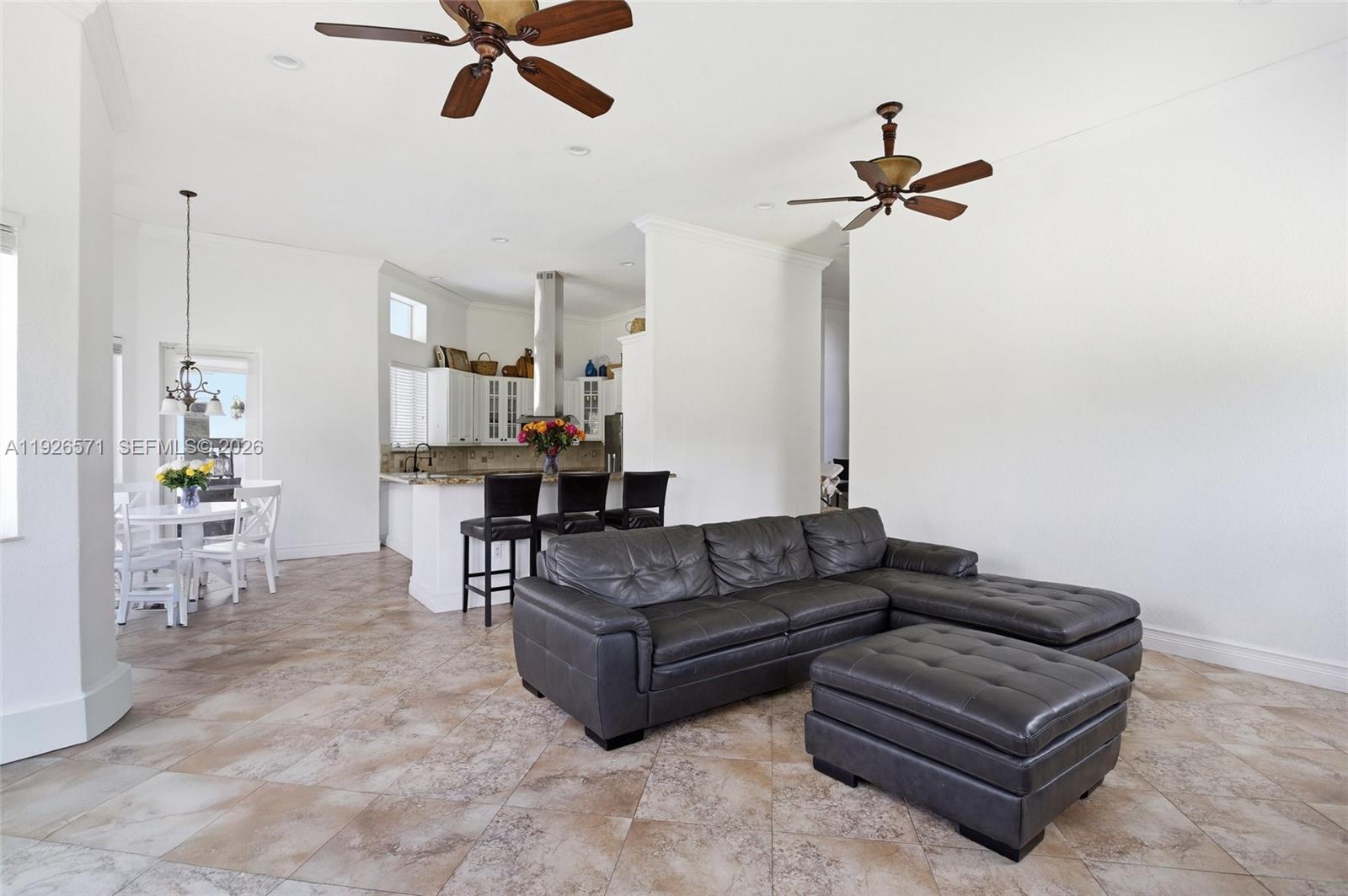 20401 Southwest 48th Place Southwest Ranches, FL 33332 - Photo 24 of 55 a living room with furniture and a wooden floor
