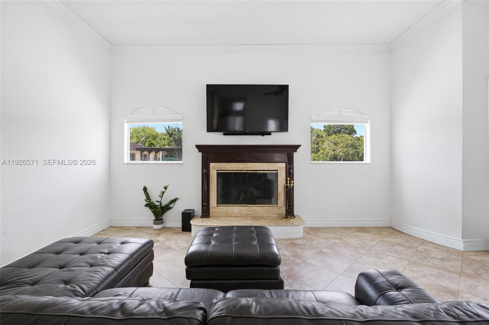 20401 Southwest 48th Place Southwest Ranches, FL 33332 - Photo 25 of 55 a living room with furniture and a fireplace