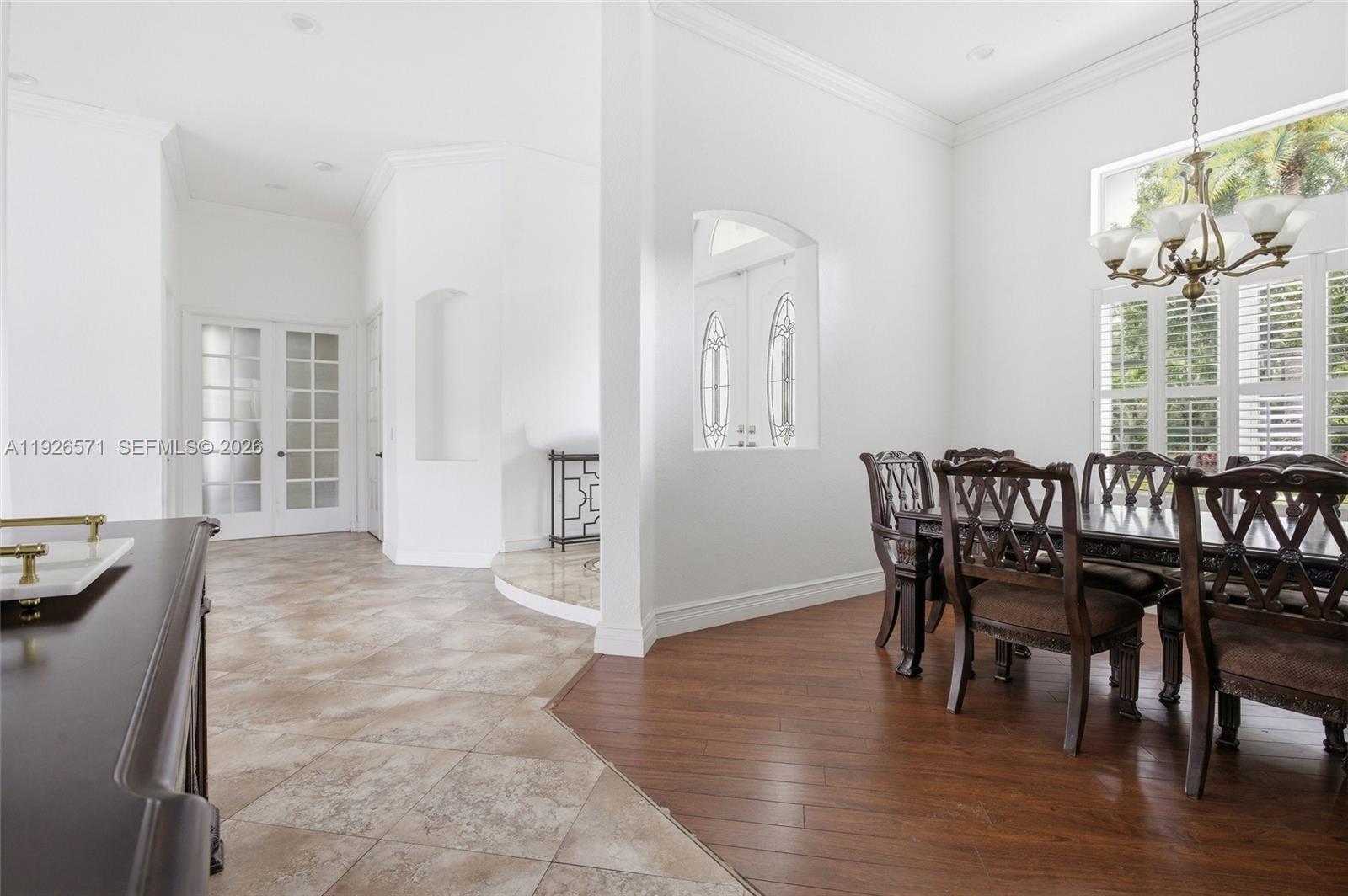 20401 Southwest 48th Place Southwest Ranches, FL 33332 - Photo 27 of 55 a view of a dining room with furniture and wooden floor