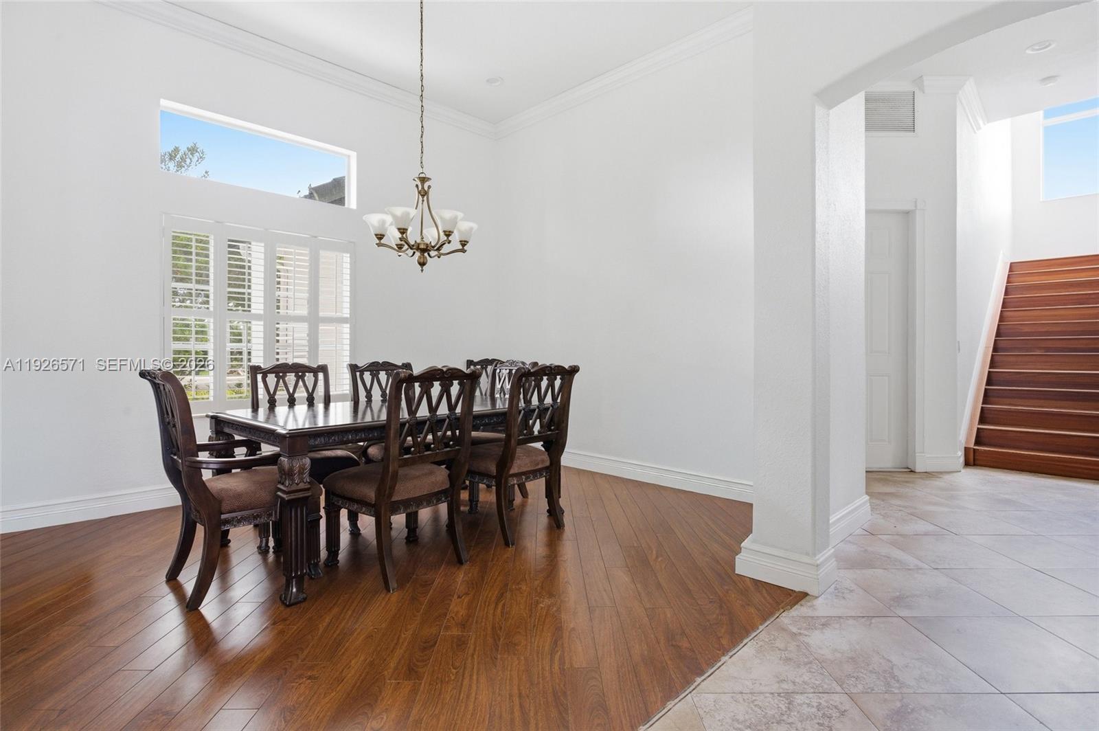20401 Southwest 48th Place Southwest Ranches, FL 33332 - Photo 29 of 55 a view of a dining room with furniture and wooden floor