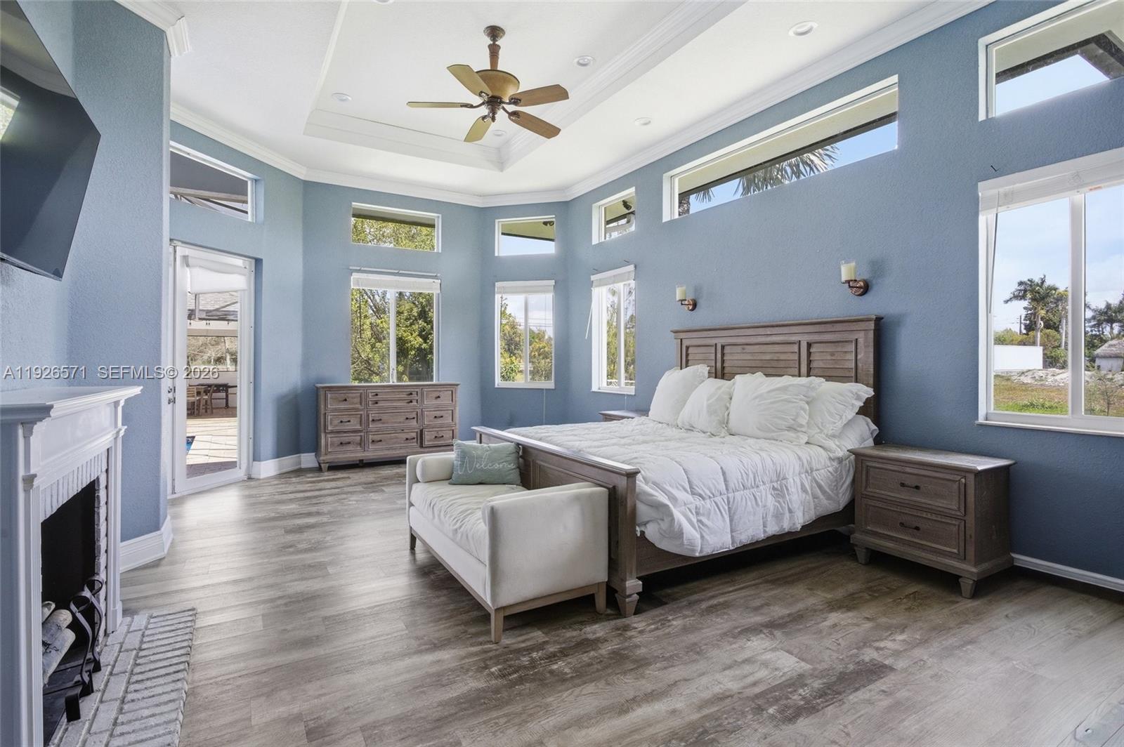 20401 Southwest 48th Place Southwest Ranches, FL 33332 - Photo 35 of 55 a spacious bedroom with a bed and a couch
