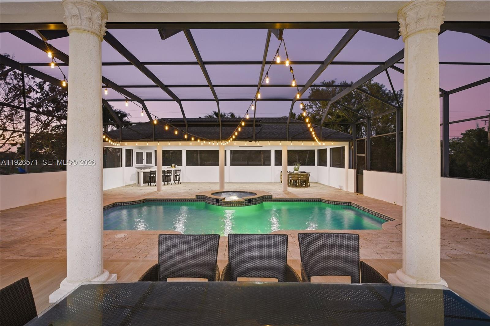 20401 Southwest 48th Place Southwest Ranches, FL 33332 - Photo 6 of 55 a view of a balcony with table and chairs