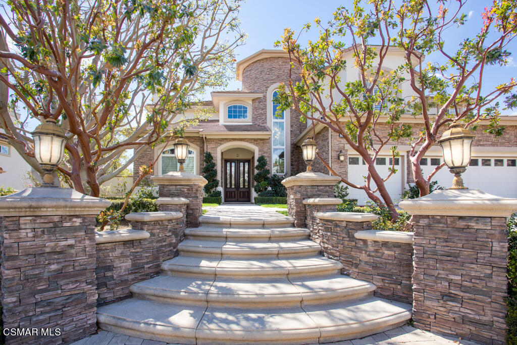 12406 Nelson Road Moorpark, CA 93021 - Photo 3 of 74 a front view of a house with a yard