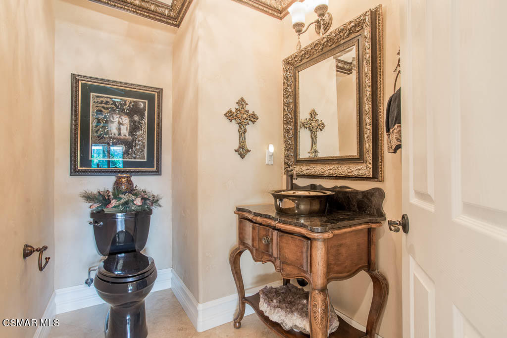 12406 Nelson Road Moorpark, CA 93021 - Photo 24 of 74 a bathroom with a sink and a mirror