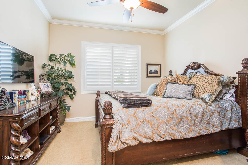 12406 Nelson Road Moorpark, CA 93021 - Photo 27 of 74 a bedroom with a bed and a flat screen tv